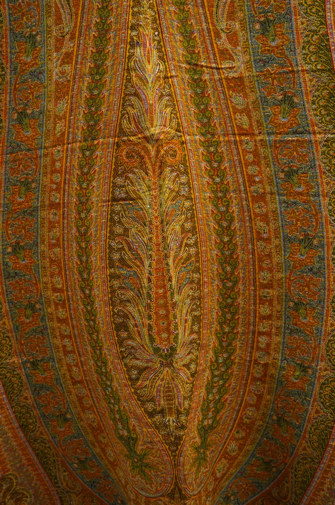 A French possibly Lyon, 19th century ornate silk and fine wool woven Paisley patterned shawl. Woven in polychromes coloured silks and wools on a jacquard loom, using an array of punch cards to create this elaborate desig